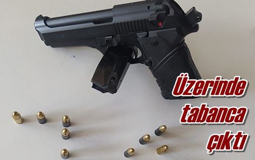 Üzerinde tabanca çıktı
