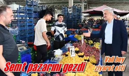 Semt pazarını gezdi