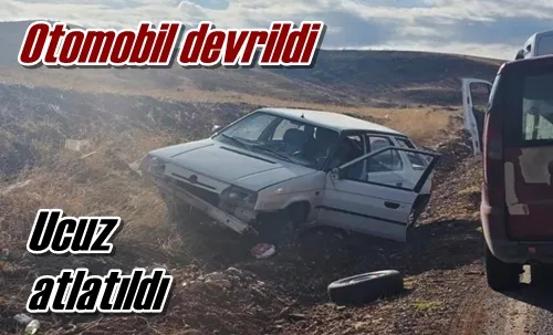 Otomobil devrildi