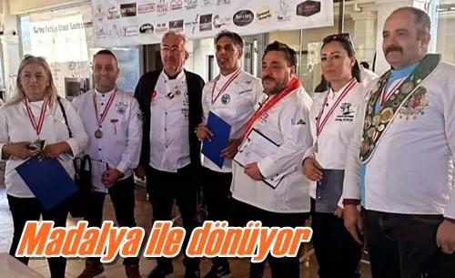 Madalya ile dönüyor